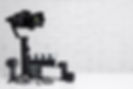 videography concept - modern dslr camera on 3-axis gimbal stabilizer, lenses, microphone,