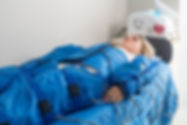 Pressotherapy machine on woman in beauty clinic. Cosmetic medicine procedure. Hardware cos