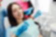 smiling-woman-dentist-chair-min-scaled (1).jpg