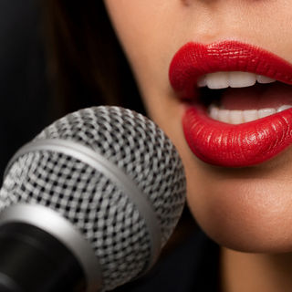 Woman speaking into a mic