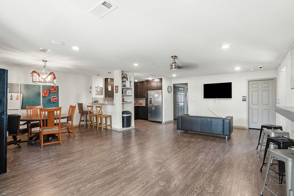 Clubhouse kitchen and game room at Lonestar 23 – gathering spot and workspace for long term RV park Weatherford guests