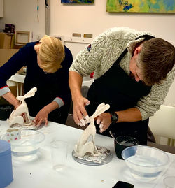 Two 'looking back' hares