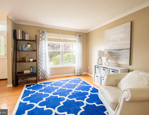 Pretty sitting room staged for the real estate market.png