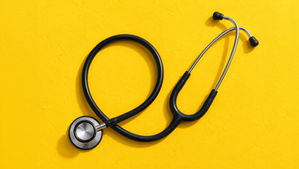 Stethoscope on yellow background