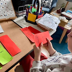 A child practices a phonics screening check using word cards.