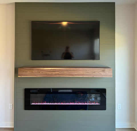Shiplap fireplace mantel with tv
