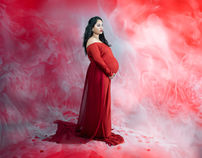 Maternity photoshoot in Bangalore with red gown and artistic studio background