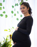 Maternity photoshoot in Bangalore with natural light and green leaf background
