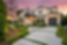 Luxury modern home with a manicured front yard, HOME. Evening sunset background.