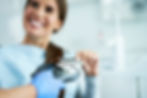 adult woman paying visit dentist office