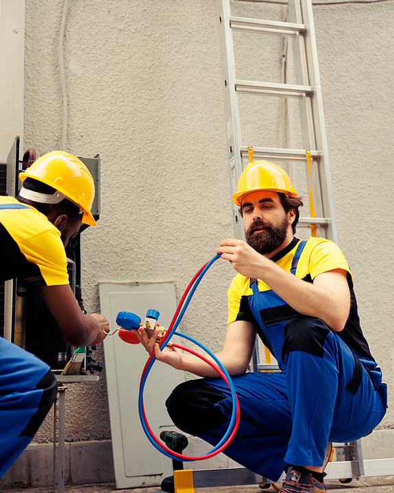 seasoned-mechanic-using-soft-dusting-brush-sweep-away-built-up-layer-dirt-debris-from-hvac