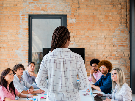 Female executive leading a boardroom meeting
