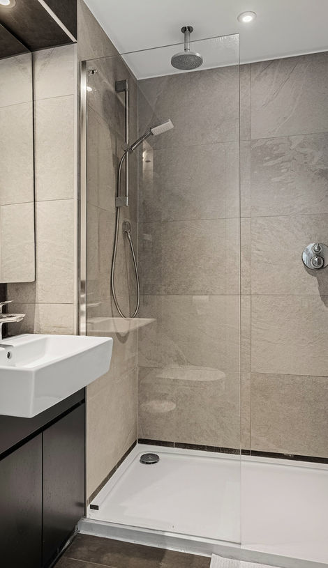 A luxury 2-bedroom apartment with dark grey porcelain tiled en-suite bathroom in Woolwich, London.