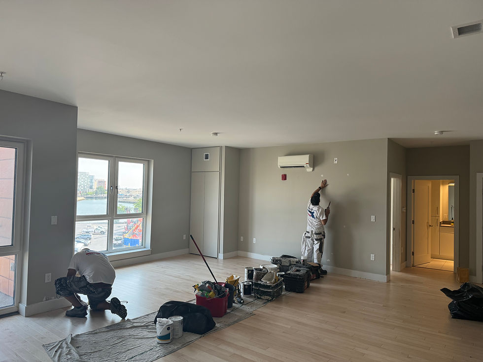JG Painting crew carefully preparing and painting an interior living space
