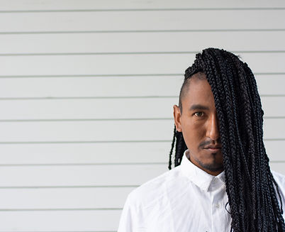 Portrait of a black man with braided hair.jpg