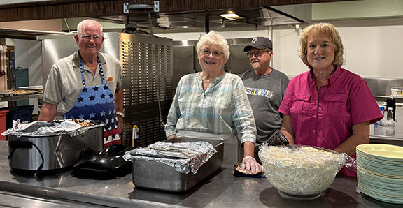 John, Joan, Neil and Wendy ready to serve the meal
