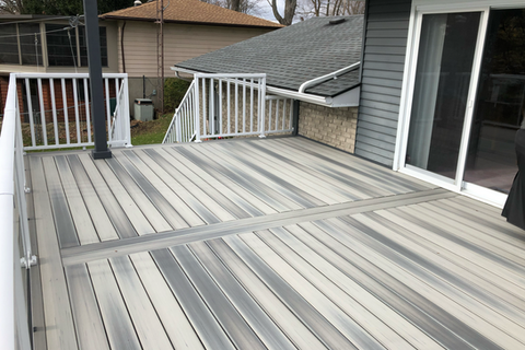 Composite deck with white aluminum railing and spindles