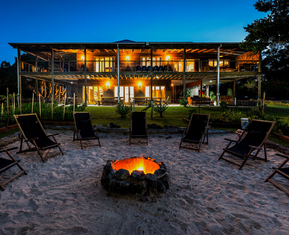 Beach house bonfire: Tranquil beach house at night