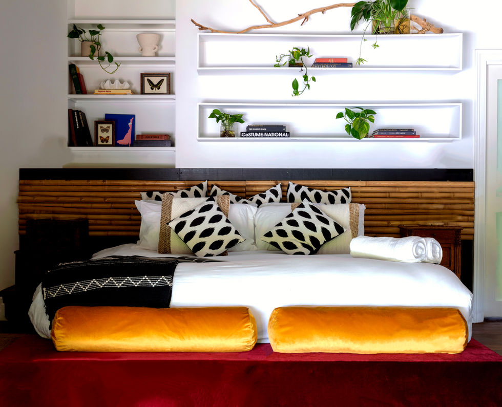Tranquil bedroom with built-in shelves and plants