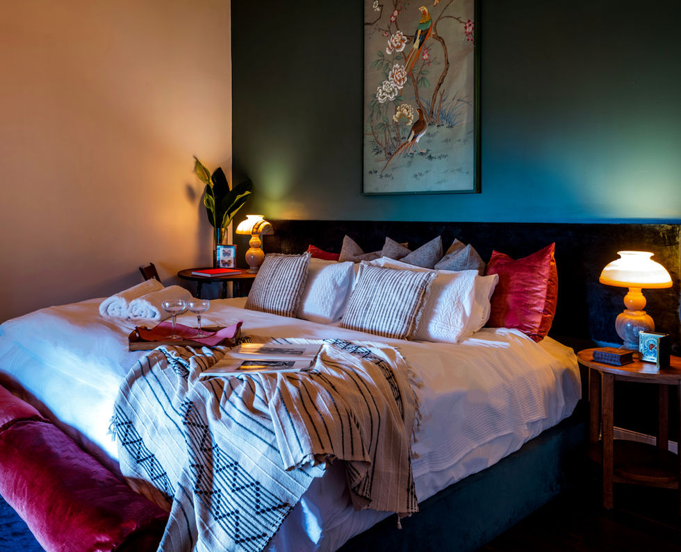 Tranquil bedroom with king-size bed, artwork, tranquilobeachhouse