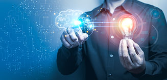 businessman-holding-illuminated-light-bulb-and-pointing-at-digital-human-brain-as-innovati