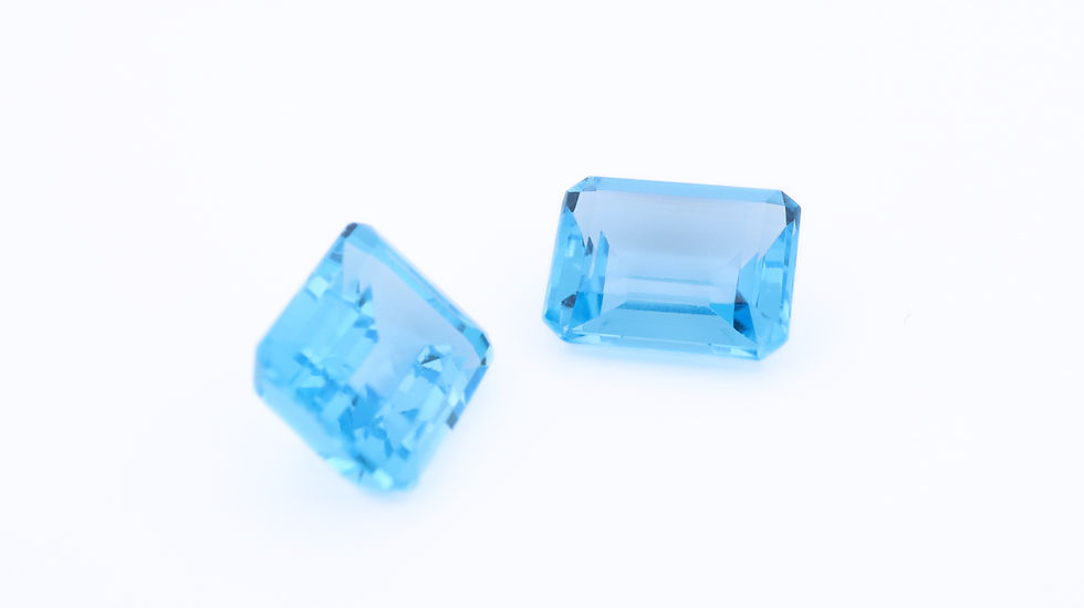 Side photo of a pair of Swiss blue topaz, rectangular cut, 10x8mm