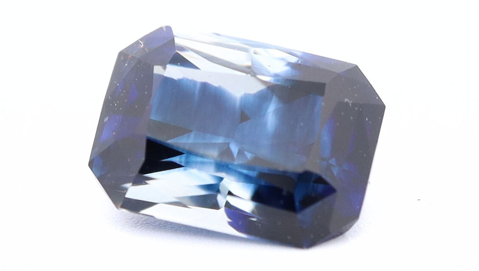 Zoomed front photo of the sapphire, where the blue seems to be hand painted inside the stone. Quite a unique feature.