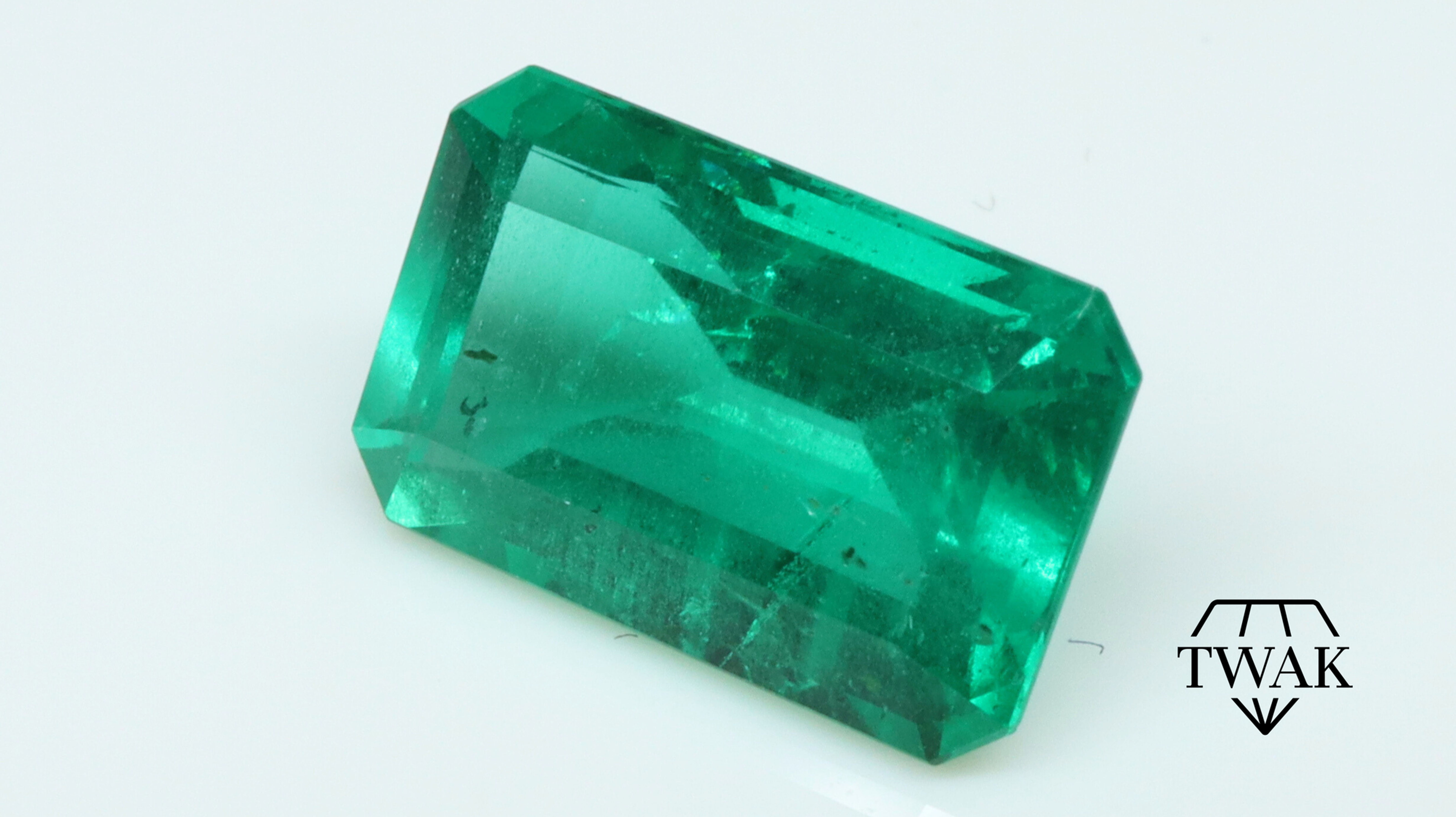 A Natural intense green emerald front view