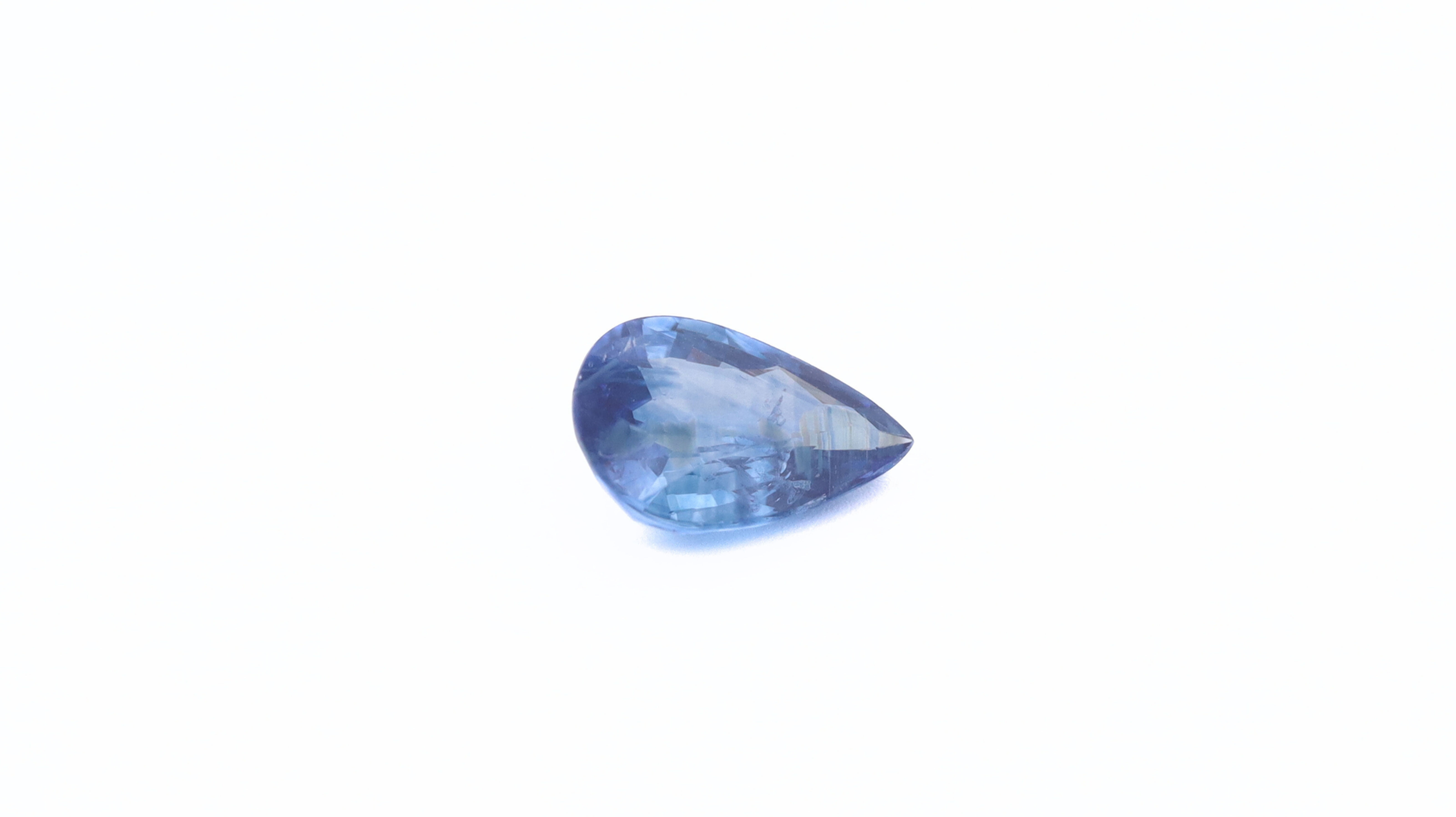 Front photo of a blue Sapphire, pear cut, measuring 8.33x5.65x3.18mm and weighting 1.20ct, with a white background.
