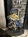 Cast iron doorstop or statuette, possibly depiciting a grotesque or whimsical figure_