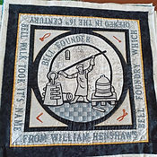Textile tile with a man in a circle in the centre doing metal work with bells - With Bell