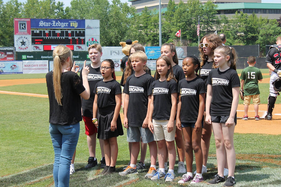 conducting BYE's national anthem at a New Jersey Jackals game.