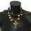 Thumbnail: Dolce & Gabbana Gold Brass Crystal Floral Statement Charms Necklace