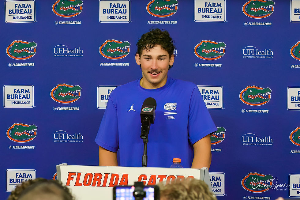 A Florida player speaks with reporters after the win.