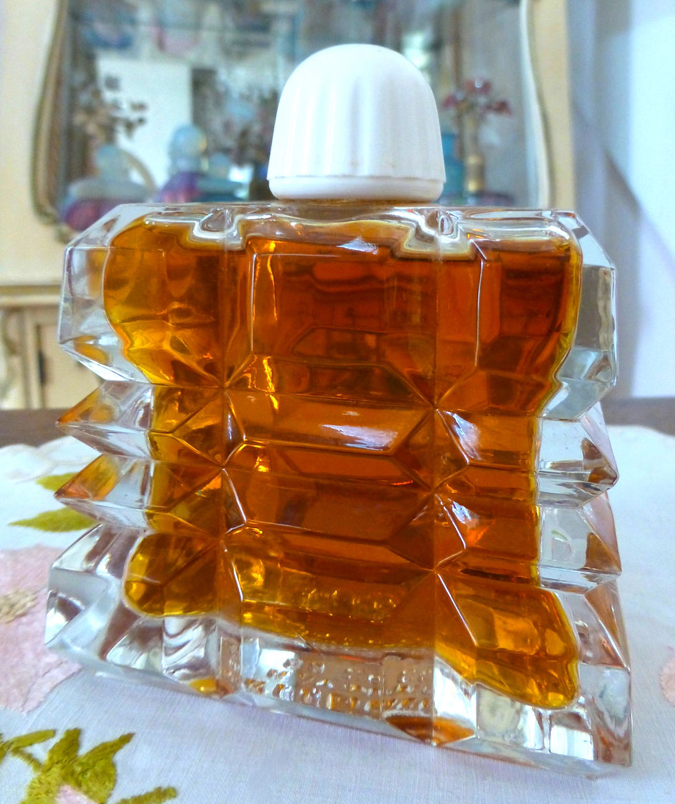 Thumbnail: Rare 1940s Mimzy by Parfumerie de Raymond, 2.7 oz vintage French eau de toilette in a striking Art Deco stepped glass bottle.