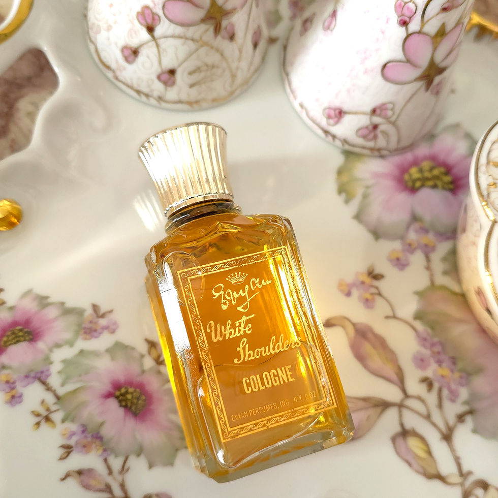 Thumbnail: Vintage 1959–1962 Evyan White Shoulders Cologne 2 oz glass splash bottle with gold fluted cap and golden perfume.