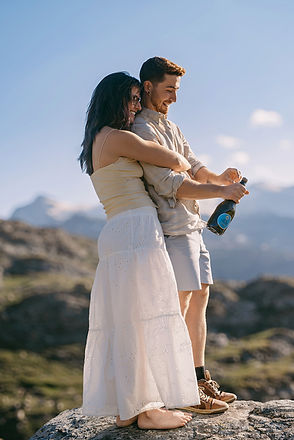 A couple celebrating after a surprise switzerland proposal