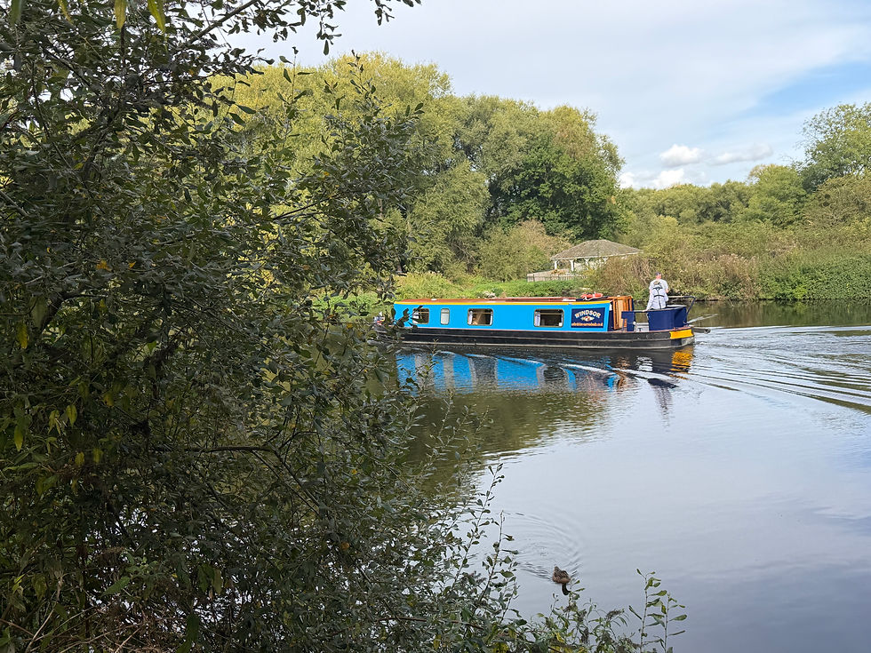 A river barge floating along the Thames.