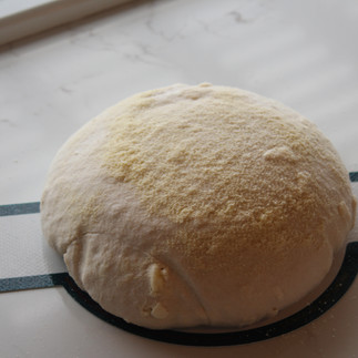 sourdough on a sling with semolina flour sprinkled over