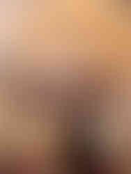 girl with long brown hair looking inside fotoautomatica photo booth