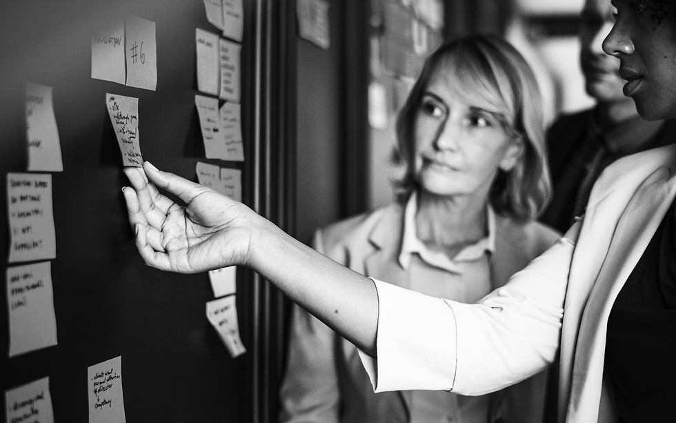 businesspeople-planning-tasks-with-sticky-notes.jpg