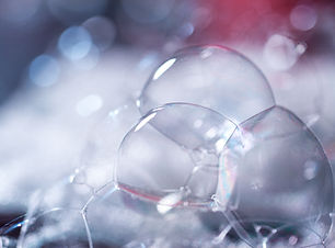 Lather very close up. Abstract background. White foam. large bubbles on blurred background