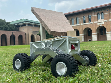 Rover prototype in front of the 45 degree stone on the engineering quad