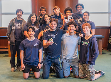 Rice Robotics Research and Development team pose for a photo with an early prototype of the R&D CatBot jumping leg