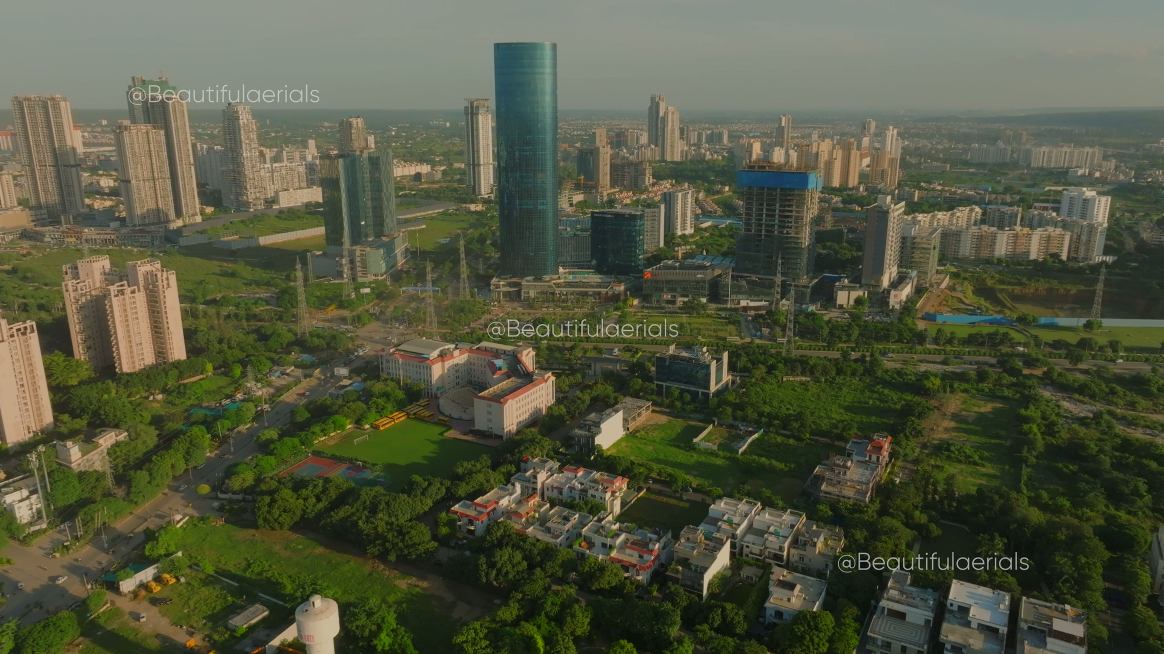 Beautiful aerial reveal shot of Gurgaon's landscape on a bright clear sunny day