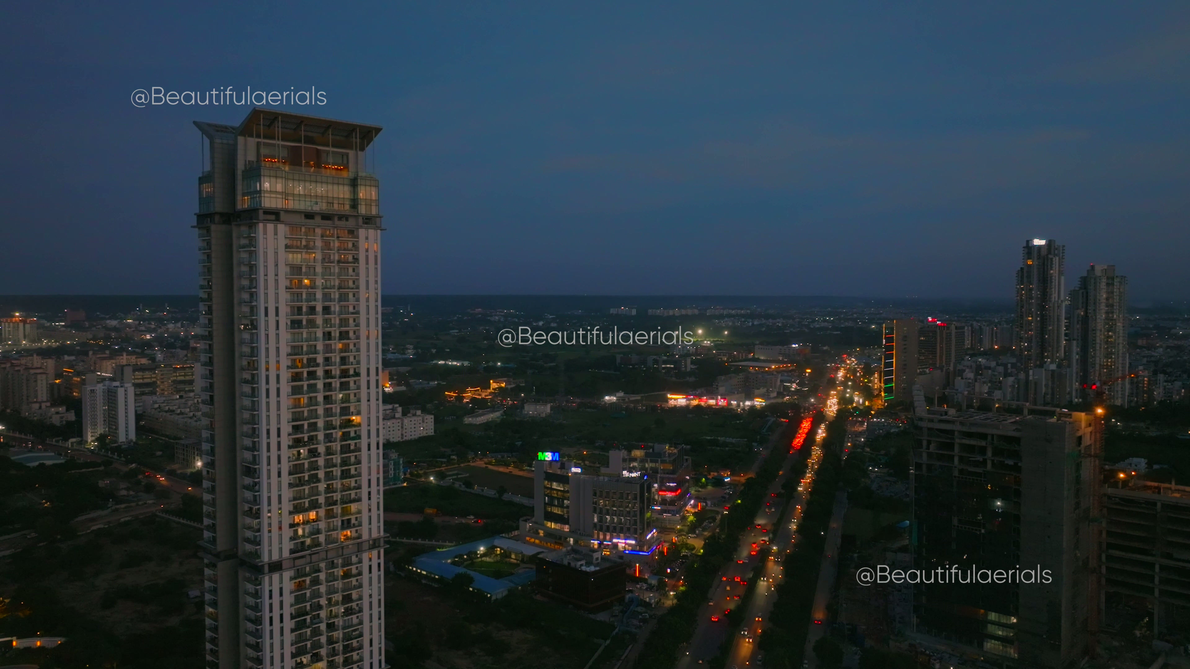Blue hour Aerial view of M3M Latitude residential building in sector 65 Gurgaon