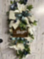 Thumbnail: Mint and white door swag.   Tiger lilies,   Blue sunflower,   Dandelion pompom