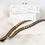 Miniature : Gold studded straps for bras, laying flat.