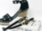 Thumbnail: Bra straps with gold pyramid studs and black faux-suede. Gold studded bra straps on a box, in front black wedge sandals.