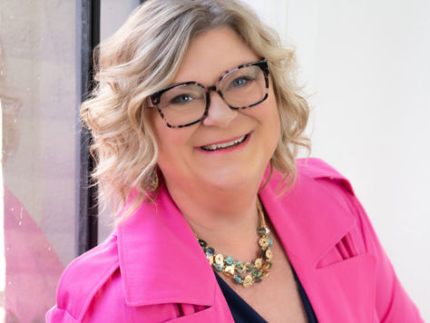 Lisa Duerre sitting alongside a window